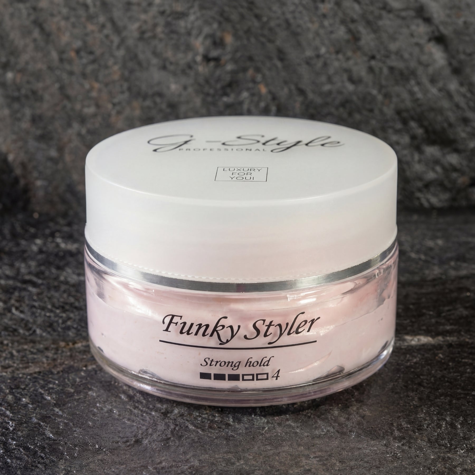 G-Style Professional Funky Styler matte hair paste pot op zwarte rots achtergrond